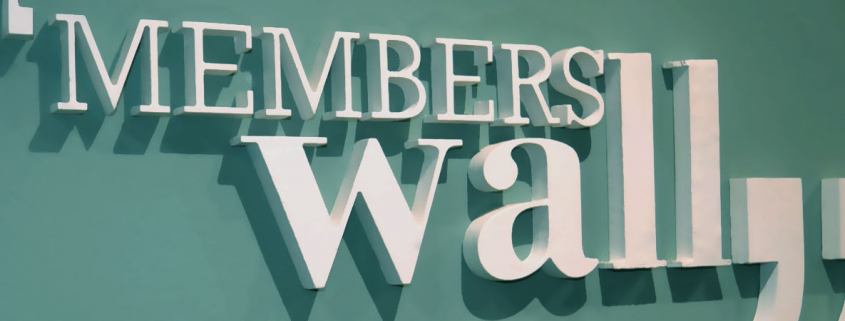 cartel de members wall